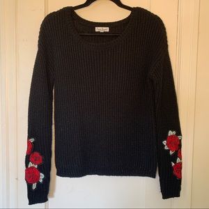 Black knit sweater roses on sleeves